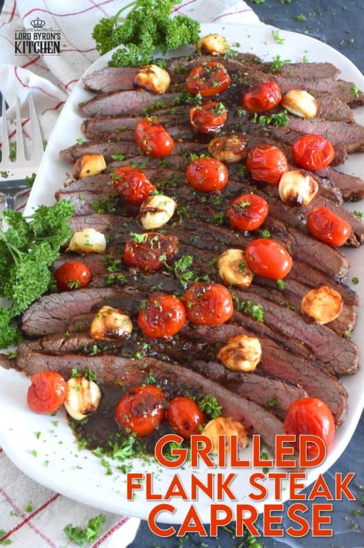 The key to a great tasting flank steak is the marinade. In this recipe, the steak is marinated in olive oil and balsamic vinegar, with mustard, honey, and garlic too. Grilled to your liking and served with blistered tomatoes and melted bocconcini, Grilled Flank Steak Caprese is a quick and easy, family-friendly meal! #flanksteak #beef #steak #grilling #caprese 