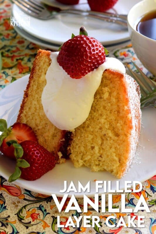 This gorgeous, easy to prepare, homemade Jam Filled Vanilla Layer Cake is not only delicious, but also quite impressive! Although basic and rustic in presentation, this cake look like a million bucks!  No cake decorating skills needed for this beautiful showpiece! And, as an added bonus, you can use your favourite jam flavour too! #jam #filling #cake #vanilla #easy #center