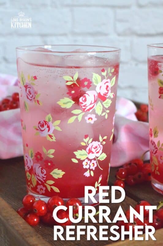 Cold, sweet, sparkling, and fizzy; this Red Currant Refresher starts with a red currant infused simple syrup and is stirred into lemon lime pop with lots of ice. Eat your heart out, Starbucks! Summer never tasted so good! #red #currant #redcurrants #currants #summer #drink #refresher