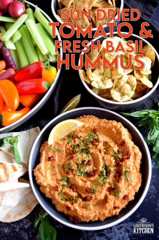 Homemade hummus is always best and it's easy too!  All you need is a few basic ingredients to make this delicious Sun Dried Tomato and Fresh Basil Hummus.  This one is savoury and slightly salty. And, the brightness from the fresh lemon juice is stellar! You'll never buy prepared hummus again! #hummus #homemade #sundriedtomatoes #basil #spreads #dips