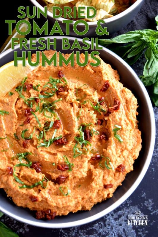Homemade hummus is always best and it's easy too!  All you need is a few basic ingredients to make this delicious Sun Dried Tomato and Fresh Basil Hummus.  This one is savoury and slightly salty. And, the brightness from the fresh lemon juice is stellar! You'll never buy prepared hummus again! #hummus #homemade #sundriedtomatoes #basil #spreads #dips