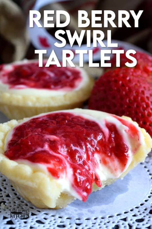 An easy to assemble treat perfect for any Canada Day celebration. Red Berry Swirl Tartlets are flaky, buttery, creamy, and sweet. Buy store-bought frozen tart shells to make this recipe fast and easier.  These are stuffed with a cream cheese filling and a red berry compote! #canadaday #recipes #redandwhite #tarts #berry #red