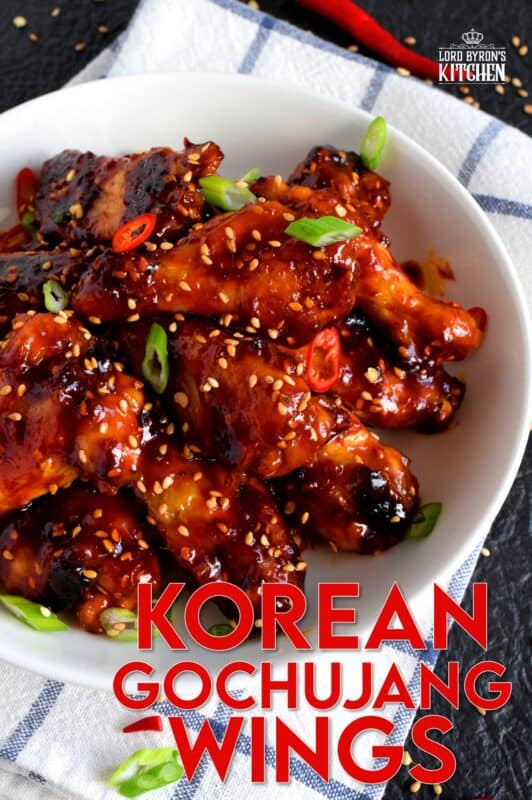 Perfectly baked chicken wings which have been tossed in a spicy sauce! Korean Gochujang Chicken Wings are completely addictive! These hit all of your taste buds with a little bit of spice, heat, sweet, and salt! #korean #gochujang #chicken #wings #spicy