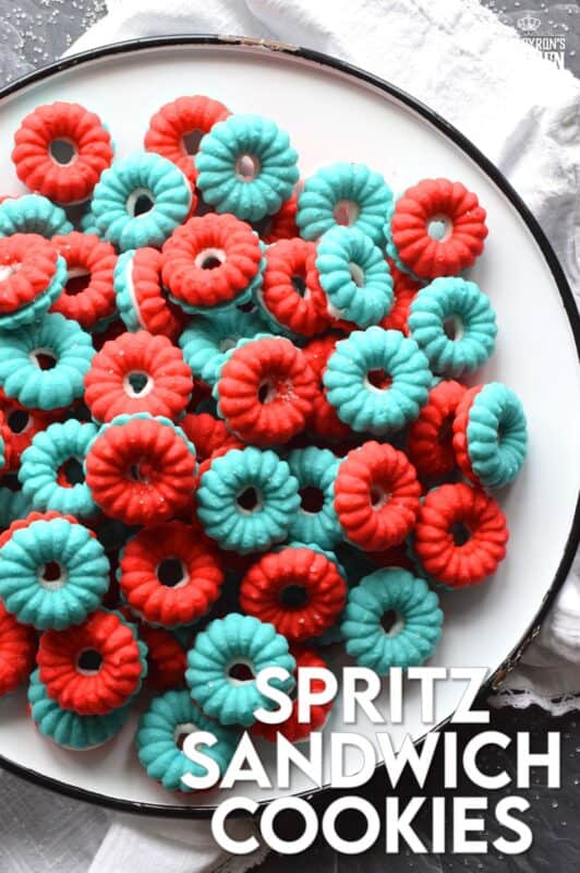 Everyone loves a spritz cookie, especially at Christmas! But, why should they only make an appearance once a year? In this version, I've coloured the cookie dough red and blue and sandwiched them with white frosting. These are most certainly bright and festive - perfect for your 4th of July celebrations! #spritz #cookies #sandwichcookies #redwhiteblue #4thofjuly #redwhiteandblue