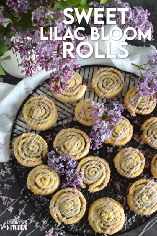 Sweet Lilac Bloom Rolls are made with a light, buttery, biscuit-like dough and rolled tightly with sugar and lilac petals. The sugar melts and begins to caramelize, while the petals infuse and permeate the rolls with a fresh fragrance and a mild lemony flavour. Drizzled with a lilac syrup icing, these are absolutely delicious and gorgeous too! #lilac #rolls #breakfast #brunch #frosting #iced #blooms #edibleflowers