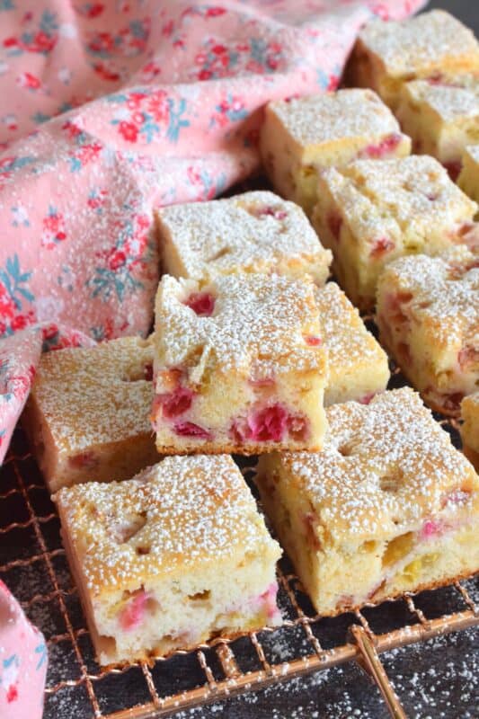 Perfectly sweet and puckeringly tart, 3 Ingredient Rhubarb Squares take thirty minutes from start to finish. These are a quick and easy treat which can be effortlessly whipped up when your neighbour announces they're dropping by for tea this afternoon. All in one bowl, so a simple clean up too! #rhubarb #squares #bars #cookies #3ingredient #dessert