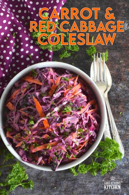 Carrot and Red Cabbage Coleslaw is the best of both worlds. It is a little bit creamy and a little bit vinegary, which is a combination of the two sides of the coleslaw debate. Vibrantly colourful and super crunchy, this coleslaw will brighten up any plate as a side, or make it a perfect addition to sandwiches, tacos, burritos, burgers, and hot dogs too!  #redcabbage #coleslaw #salad #celery #creamy #seeds