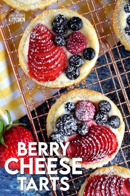 Transform store-bought, frozen sheets of puff pastry into these delightful little tarts filled with fresh berries and a lemony cream cheese filling! Use your favourite berries or fruit and then try to eat just one - it's nearly an impossible feat! #puffpastry #berries #4thofjuly #recipes #summer #creamcheese #tarts #tartlets #fruit