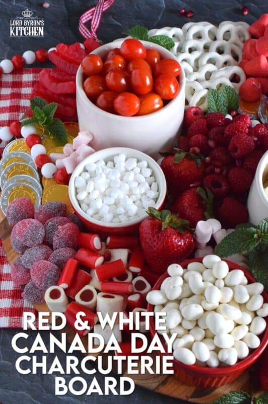Gather together a bunch of red and white snack foods to assemble this super easy Canada Day Charcuterie Board! Your friends and family will love filling up on these festive snacks. Set the board down right into the middle of your patio table, and let everyone help themselves! All you need is a bunch of napkins and lots of ice cold drinks! Happy Canada Day! #canadaday #canada #charcuterie #redandwhite #festive #snacks