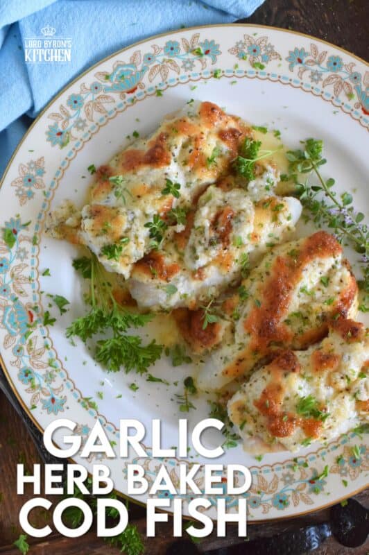 Fresh cod fillets are generously topped with fresh minced garlic and a variety of chopped fresh herbs which is combined with mayonnaise and grated parmesan cheese. The fish is perfectly baked until brown and bubbly. Garlic Herb Baked Cod Fish is both savoury and delicious! #cod #fish #seafood #bakedcod #parmesancod #freshherbs