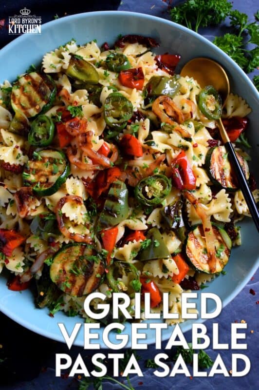 Perfectly charred bell peppers, onions, jalapenos, and zucchini make up this Grilled Vegetable Pasta Salad. Tossed with a simple, easy to make, light, oil-based homemade dressing, this is a perfect summer side! Serve warm or at room temperature! #grilled #vegetable #veggies #pasta #salad #summer #side #picnic #backyard