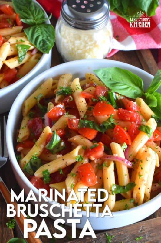This is the ultimate summer pasta salad! Fresh tomatoes are marinated with olive oil, garlic, red onions, and balsamic vinegar before being tossed with cooked pasta and fresh basil. A terrific way to use your best summer fresh tomatoes! #pasta #summerpasta #bruschetta #pastasalad #tomatoes #summertomatoes #tomatorecipes