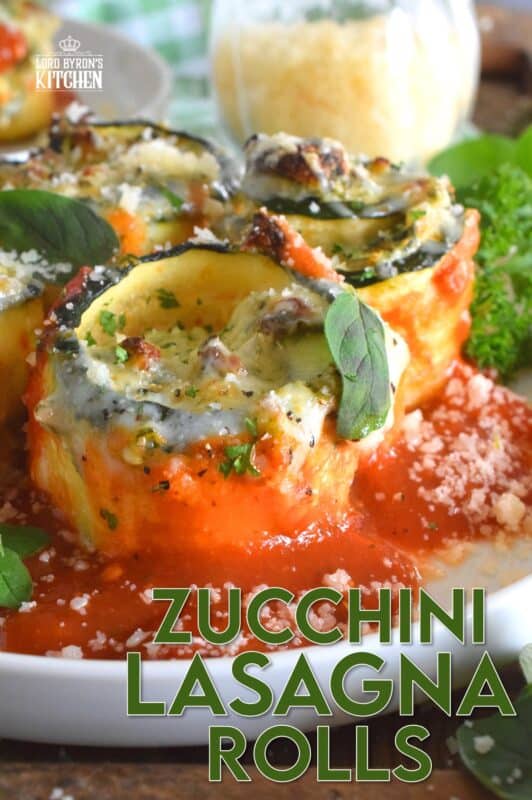 A little lighter on the carbs, Zucchini Lasagna Rolls are prepared by rolling thinly sliced zucchini with spinach, egg, three cheeses, and seasonings. Baked in marinara sauce, don't be fooled by this healthier dish; it is both filling and robust! #zucchini #zucchinirolls #lasagna #lasagnarolls #zucchinilasagna #lowcarb
