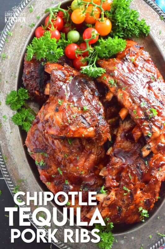 Super moist and tender pork ribs are first prepared in an instant pot and then brushed with a homemade chipotle tequila barbecue sauce. The ribs are then tossed on the grill until that delicious sauce becomes hot, sticky, and stuck to those gorgeous ribs by means of beautiful grill marks. Are you drooling yet? #chipotle #tequila #bbq #ribs #porkribs #pork
