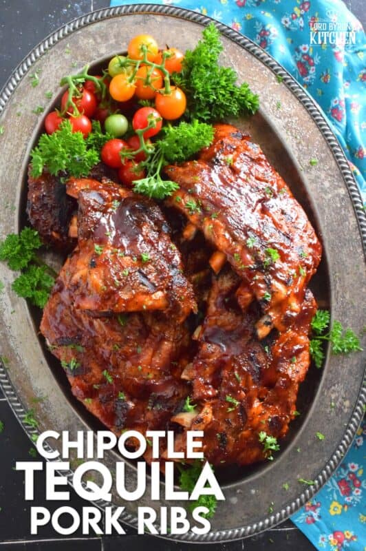 Super moist and tender pork ribs are first prepared in an instant pot and then brushed with a homemade chipotle tequila barbecue sauce. The ribs are then tossed on the grill until that delicious sauce becomes hot, sticky, and stuck to those gorgeous ribs by means of beautiful grill marks. Are you drooling yet? #chipotle #tequila #bbq #ribs #porkribs #pork