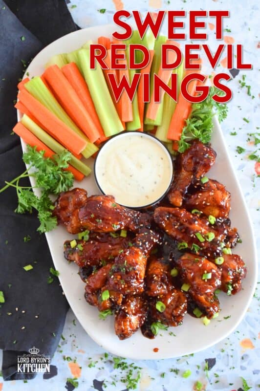 In this recipe, chicken wings are baked until golden brown and crispy and then they're tossed in a hot and spicy homemade sauce which is prepared in just a few minutes. Sweet Red Devil Wings are perfectly cooked and drenched in a thick, sticky sauce that I just can't get enough of! #sweetandsticky #wings #chicken #sauce