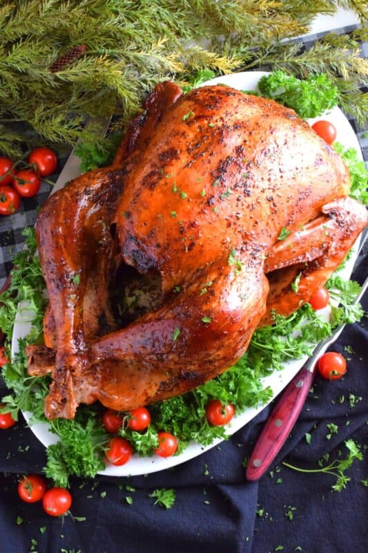 Roasting a whole turkey does not need to be complicated.  For a super moist and delicious turkey, you only need 5 ingredients and a little patience.  The secret to keeping a turkey from drying out in the oven is butter, and it's so easy! #turkey #roasted #basic #whole #how