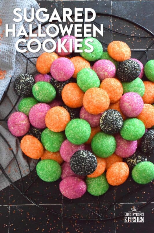 Just in time for the little trick-or-treaters in your life, these melt-in-your-mouth orange, green, purple, and black cookies are about to become everyone's favourite Halloween treat! Sugared Halloween Cookies are made with just five ingredients, and they're quick and easy too! #halloween #cookies #sugar #sanding #orangeandblack