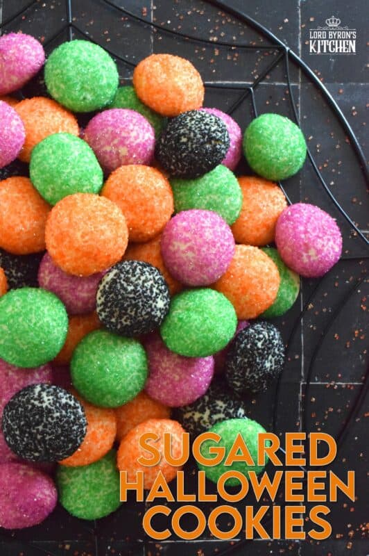 Just in time for the little trick-or-treaters in your life, these melt-in-your-mouth orange, green, purple, and black cookies are about to become everyone's favourite Halloween treat! Sugared Halloween Cookies are made with just five ingredients, and they're quick and easy too! #halloween #cookies #sugar #sanding #orangeandblack
