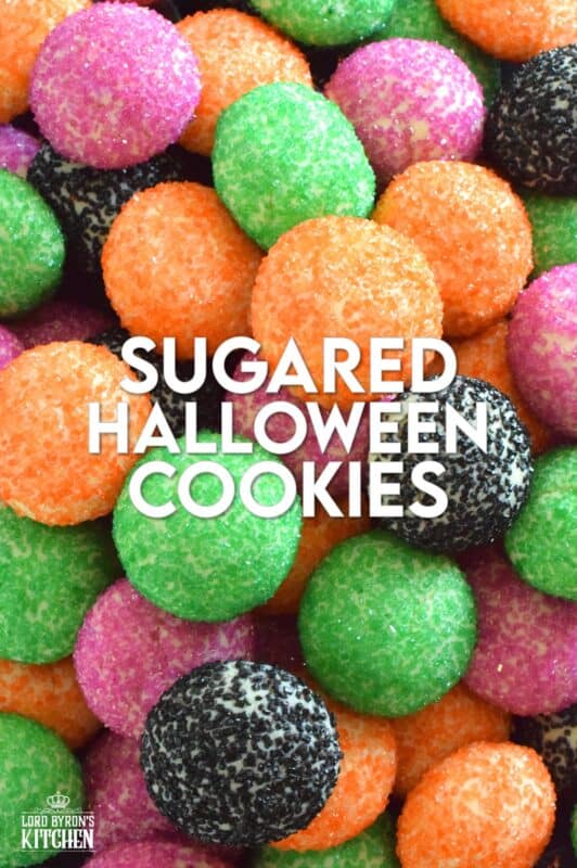 Just in time for the little trick-or-treaters in your life, these melt-in-your-mouth orange, green, purple, and black cookies are about to become everyone's favourite Halloween treat! Sugared Halloween Cookies are made with just five ingredients, and they're quick and easy too! #halloween #cookies #sugar #sanding #orangeandblack