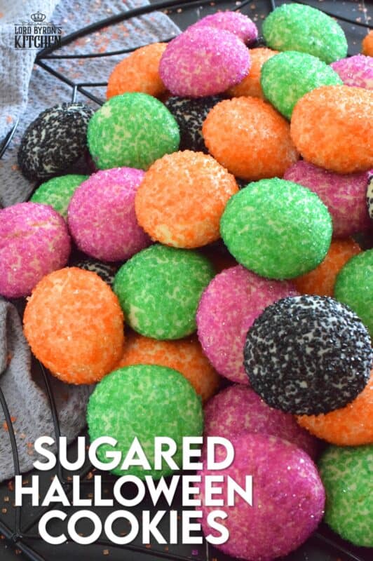 Just in time for the little trick-or-treaters in your life, these melt-in-your-mouth orange, green, purple, and black cookies are about to become everyone's favourite Halloween treat! Sugared Halloween Cookies are made with just five ingredients, and they're quick and easy too! #halloween #cookies #sugar #sanding #orangeandblack