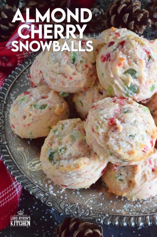 These light and fluffy Almond Cherry Snowballs are packed with both red and green candied cherries, which in our home, is the epitome of holiday baking. Prepared with the most basic of pantry ingredients, these cookies are nothing short of extraordinary, and they taste like an old fashioned Christmas at home! #snowballs #cookies #candied #cherries #almond #christmas #baking