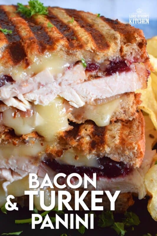 Stuffed to the max with sliced turkey, crispy bacon, and cranberry sauce, this Bacon and Turkey Panini is very moist and juicy. Oh, and it's also loaded with melted, gooey cheese! This sandwich is the best way to use up your Thanksgiving leftovers! If you don't have a panini press, don't worry; I have a solution! #sandwich #panini #grilledsandwich #paninipress #leftovers #turkey #bacon
