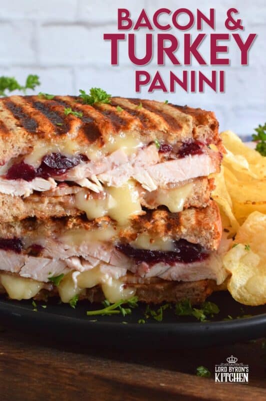 Stuffed to the max with sliced turkey, crispy bacon, and cranberry sauce, this Bacon and Turkey Panini is very moist and juicy. Oh, and it's also loaded with melted, gooey cheese! This sandwich is the best way to use up your Thanksgiving leftovers! If you don't have a panini press, don't worry; I have a solution! #sandwich #panini #grilledsandwich #paninipress #leftovers #turkey #bacon