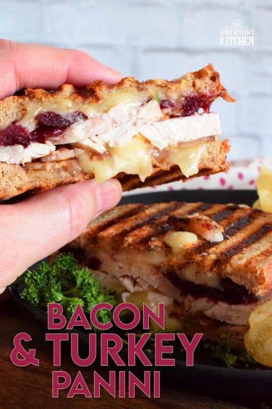 Stuffed to the max with sliced turkey, crispy bacon, and cranberry sauce, this Bacon and Turkey Panini is very moist and juicy. Oh, and it's also loaded with melted, gooey cheese! This sandwich is the best way to use up your Thanksgiving leftovers! If you don't have a panini press, don't worry; I have a solution! #sandwich #panini #grilledsandwich #paninipress #leftovers #turkey #bacon