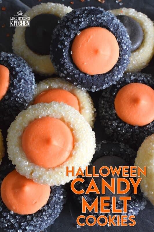 Similar to a classic thumbprint cookie, these Halloween Candy Melt Cookies use candy melts instead of jam. The cookie dough is tinted with food colouring and rolled in sanding sugar, these are all treat and no trick! #halloween #trickortreat #halloweencookies #candymelts #thumbprint