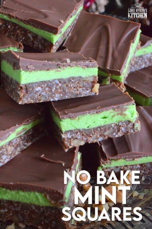 Triple-layered with wonderful flavours, these No Bake Mint Squares are perfectly festive for the holiday season.  With a coconut, walnut, and graham crumb base, and a creamy mint filling, these squares are topped with melted chocolate which makes them all the more rich and delicious.  You simply must add these to your Christmas cookie platter! #nanaimo #mint #peppermint #squares #bars #nobake
