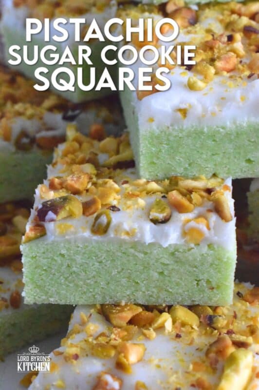 The uncomplicated and delicious sugar cookie gets a fresh, new flavour profile, and an upgrade in this Pistachio Sugar Cookie Squares recipe.  The classic sugar cookie base is pistachio flavoured and prepared with boxed pistachio pudding powder.  Topped with a layer of delicious buttercream frosting and sprinkled with roasted, salted chopped pistachios, this cookie is simply irresistible! #pistachio #sugarcookies #cookies #christmas #holiday #squares #baking
