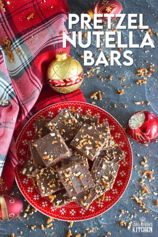Nutella is very popular in most families, especially families with kids.  Pretzel Nutella Bars combines the nutty and creamy chocolatey-ness that is Nutella with the crunchiness and saltiness of pretzels.  And, if that wasn't enough, the bars are topped with melted Mirage Candy Bars!   #nutella #candybar #chocolate #bars #nobake