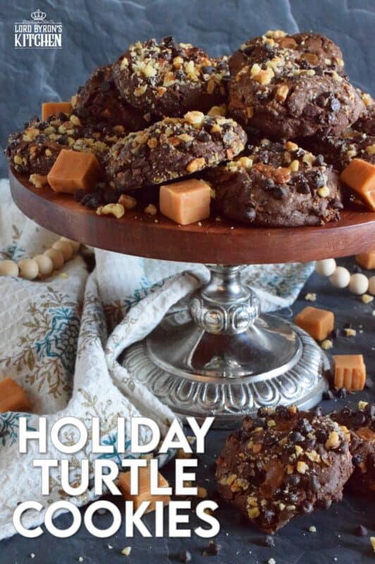 Turtles, turtles, rah, rah, rah! If you remember that jingle and you ate the popular chocolate confection that was popularized by it, then you might enjoy these Holiday Turtle Cookies too! Baked inside and outside of the most delicious chocolate cookie dough are toasted pecans, chocolate chips, and lots of sticky, gooey caramel.  You're going to love this one! #turtles #chocolate #cookies #caramel #pecans