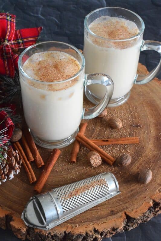 Quick and easy, this Bourbon Spiked Eggnog cocktail uses store-bought and ready eggnog and combines it with a good splash of bourbon and lots of freshly grated nutmeg. It's yummy! #eggnog #bourbon #cocktail #drinks