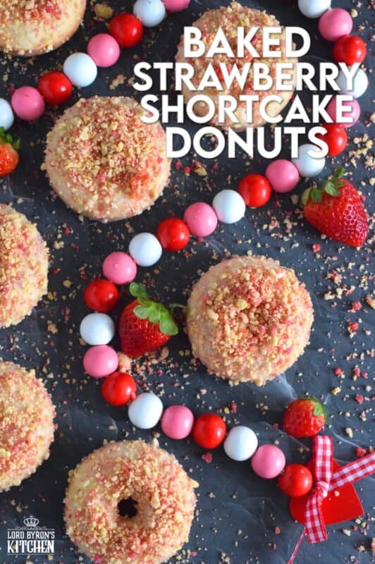 Baked Strawberry Shortcake Donuts are prepared with homemade strawberry shortcake crumbs! Baked to perfection in only 10 minutes, glazed and topped with more shortcake crumbs, these donuts are super soft and moist and very cake-like inside. Share these with your favourite valentine or save them all for yourself! #strawberry #donuts #doughnuts #valentine