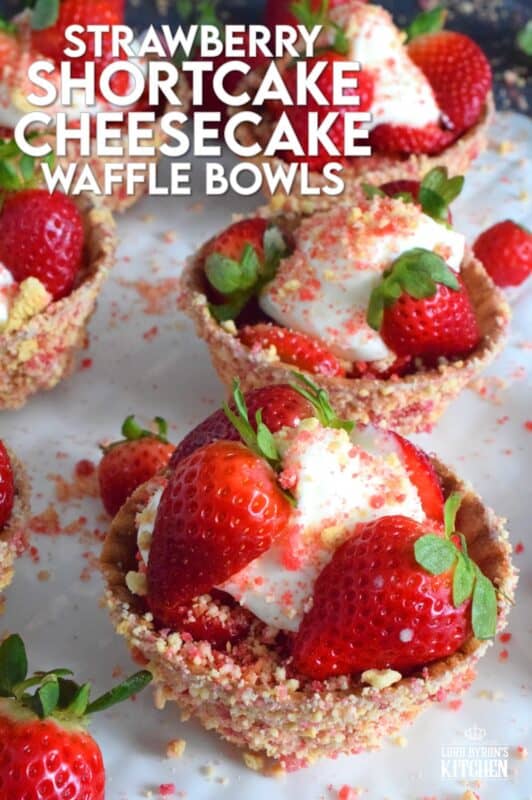Sugary sweet and crunchy waffle bowls are coated with strawberry shortcake crumbs and filled with a light and fluffy cheesecake mixture, topped with fresh strawberries, and more strawberry shortcake crumbs. This gorgeously impressive dessert is for the serious strawberry lover! #shortcake #waffle #strawberry #cheesecake