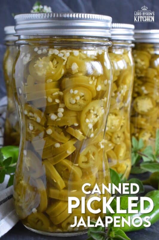 Pair these Canned Pickled Jalapenos with sandwiches, pizza, nachos, burgers, and even scrambled eggs!  All you need to prepare these are jalapenos, white vinegar, salt, and water!  Easily double or even triple the recipe and stock your canning pantry with these delicious hot and spicy morsels! #pickled #jalapenos