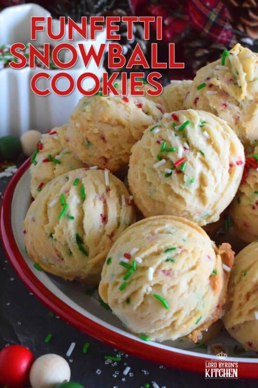 A holiday cookie platter must always have a cookie that is packed with sprinkles and these Funfetti Snowball Cookies fit the bill quite nicely!  These are puffy, rounded cookies that require only a few of the most basic pantry ingredients, yet they look and taste amazing! #funfetti #christmas #cookies #sprinkles