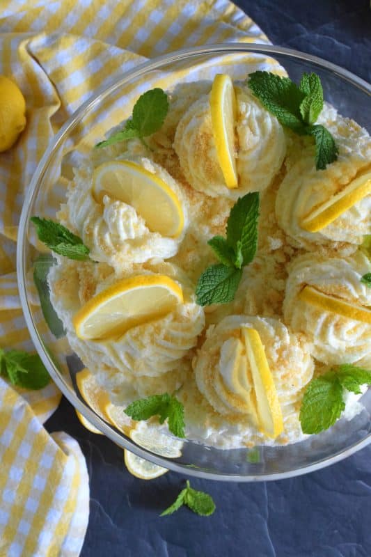Refreshingly tart with a silky smooth and sweet mascarpone filling, Limoncello Tiramisu has to be one of the most delicious summertime desserts. With layers of light and airy ladyfingers, and a thick, slightly sweet filling, balanced with the puckering taste of fresh lemons, this dessert is completely irresistible! #limoncello #lemon #tiramisu