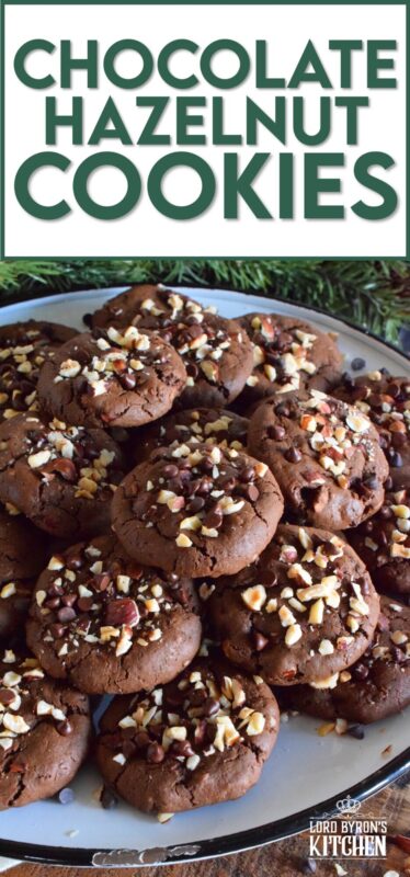 These cookies are slightly crispy on the outside, but with a moist and dense chocolaty center. Loaded with lots of chocolate chips and hazelnuts, Chocolate Hazelnut Cookies taste very much like eating a big spoon of Nutella in cookie form! #chocolatecookies #hazelnut #christmas #holiday #baking