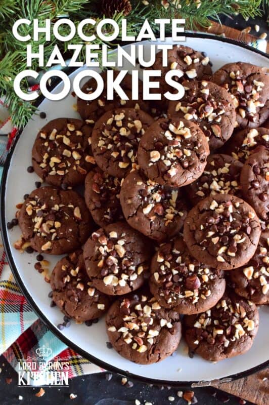 These cookies are slightly crispy on the outside, but with a moist and dense chocolaty center. Loaded with lots of chocolate chips and hazelnuts, Chocolate Hazelnut Cookies taste very much like eating a big spoon of Nutella in cookie form! #chocolatecookies #hazelnut #christmas #holiday #baking