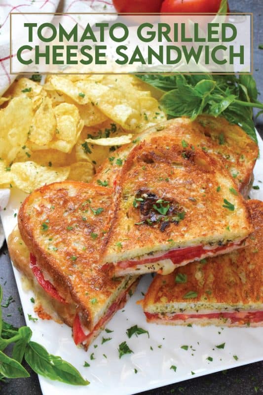 One of the most comforting and nostalgic childhood favourites is a grilled cheese sandwich paired with tomato soup. Nobody wants to eat soup in the summer, so my Tomato Grilled Cheese Sandwich is perfect! Summer fresh tomatoes and basil pesto are tucked into the sandwich to make the ultimate flavour combination!