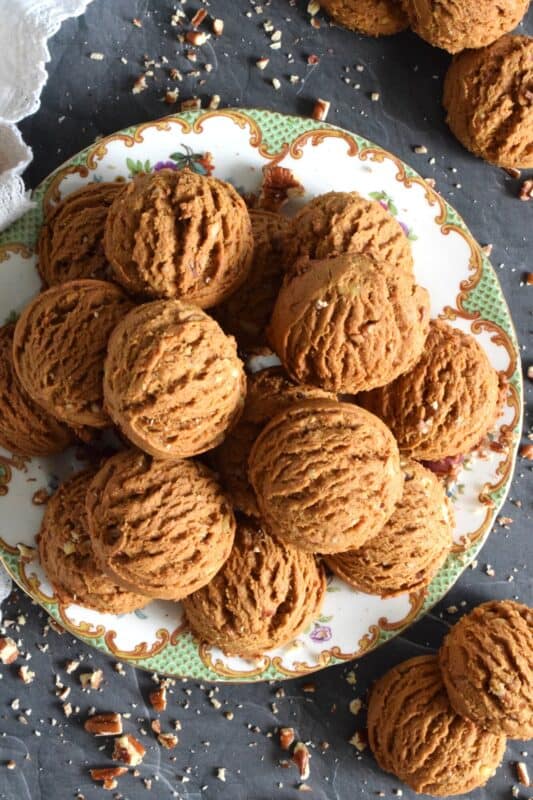 These plump, soft cookies are made with lots of familiar spices associated with fall baking.  Pecan Molasses Cookies are very easy to prepare; simply make the cookie dough and use a cookie scoop to portion out mounds onto your baking sheet.  Let your oven do the rest!  These are one of my all-time favourite cookies! #pecan #molasses #cookies