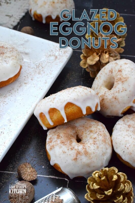 These Glazed Eggnog Donuts are baked and not fried, which means they are super light and fluffy.  Eggnog is baked right into the batter and the glaze is made with eggnog too, ensuring that this donut lives up to its name!  Optionally, this recipe permits a splash or rum or an alcohol-free version too! #donuts #doughnuts #eggnog #christmas #baked