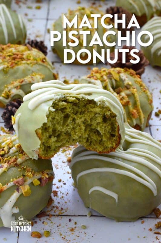 Everything is coming up green in these Matcha Pistachio Donuts!  The batter is light and fluffy and prepared with finely chopped pistachios and matcha.  Dipped in matcha-infused icing and drizzled with white chocolate, these donuts are delicious and addictive! #matcha #greentea #donuts #pistachio