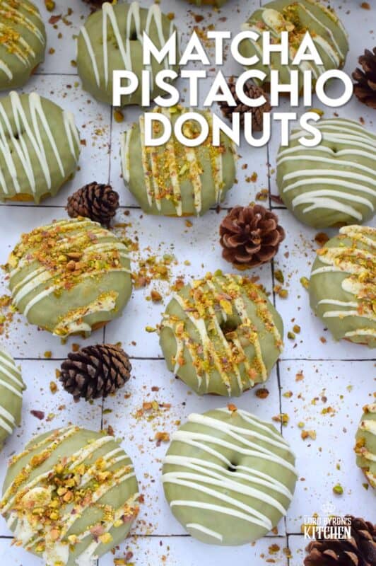 Everything is coming up green in these Matcha Pistachio Donuts!  The batter is light and fluffy and prepared with finely chopped pistachios and matcha.  Dipped in matcha-infused icing and drizzled with white chocolate, these donuts are delicious and addictive! #matcha #greentea #donuts #pistachio