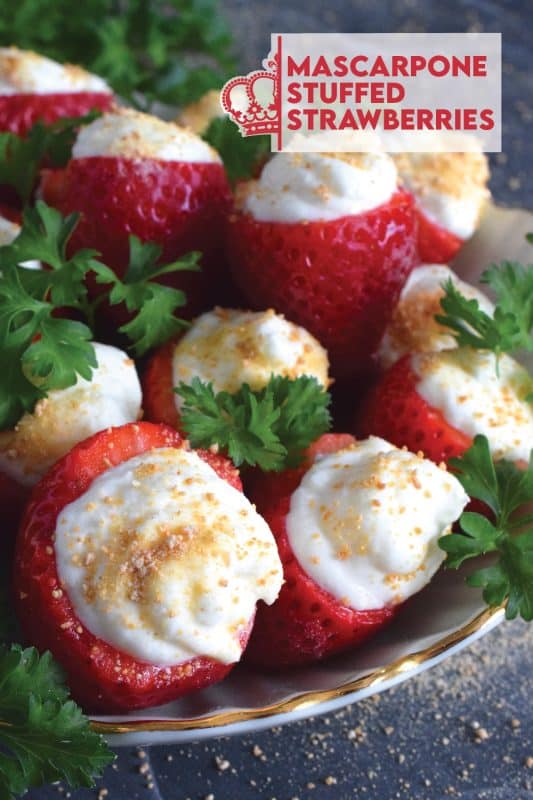 Mascarpone is blended with cream, sugar, and vanilla to make the most delicious dessert topping. In this recipe, the mixture is stuffed into hulled fresh strawberries and topped with a sprinkling of graham cracker crumbs for texture and flavour. This simple and easy dessert is big on taste! #mascarpone #stuffed #strawberries #nobake #dessert