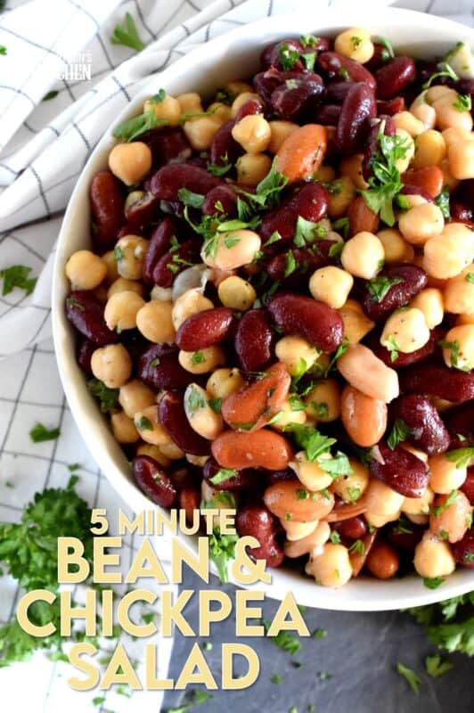 A quick, delicious, and hearty salad that's perfect for any occasion! This 5 Minute Bean and Chickpea Salad will pair well with anything you serve at a picnic, backyard barbecue, or local church potluck! A tangy and savoury salad this good and this inexpensive is a keeper for sure! #chickpea #bean #salad #side #vegetarian #nobake #canned #5minuterecipes