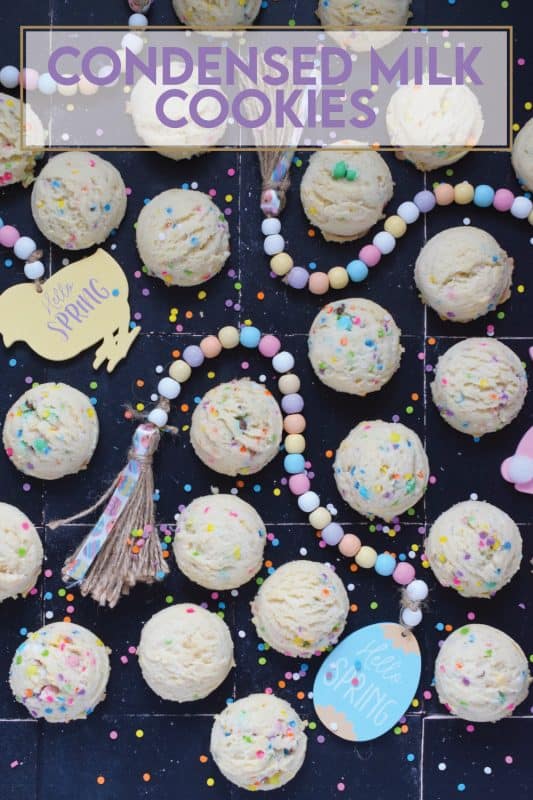 There is no better time to bake a cookie that is packed with sprinkles and chocolates than Easter!  This Easter Condensed Milk Cookie is very easy to make and requires only five common pantry ingredients in addition to the sprinkles and chocolate.  They are puffy, light, airy, and delicious! #easter #cookies #cadbury #minieggs #chocolate #sprinkles